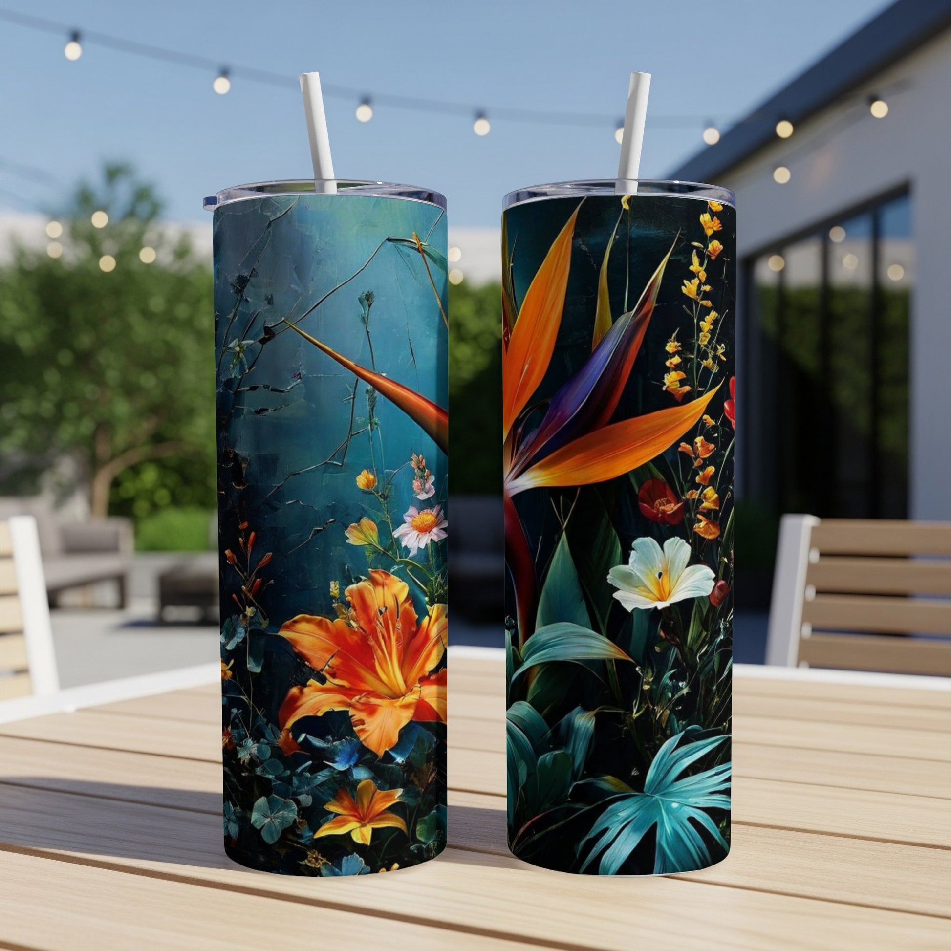 Two tall tumblers with a vibrant floral design, featuring birds of paradise and lilies.