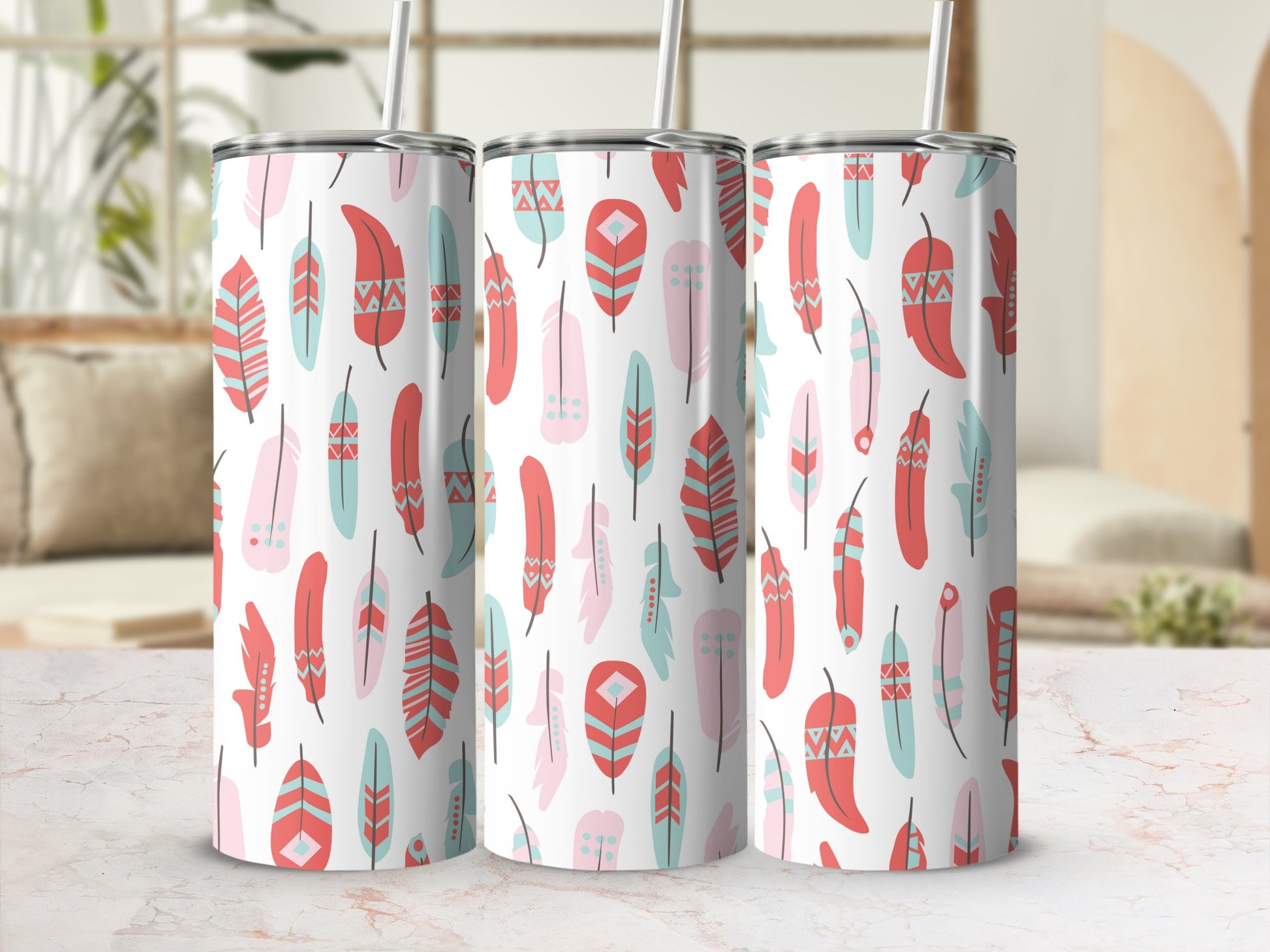 Three tumblers with a white background and a pattern of pink, coral, and teal feathers.