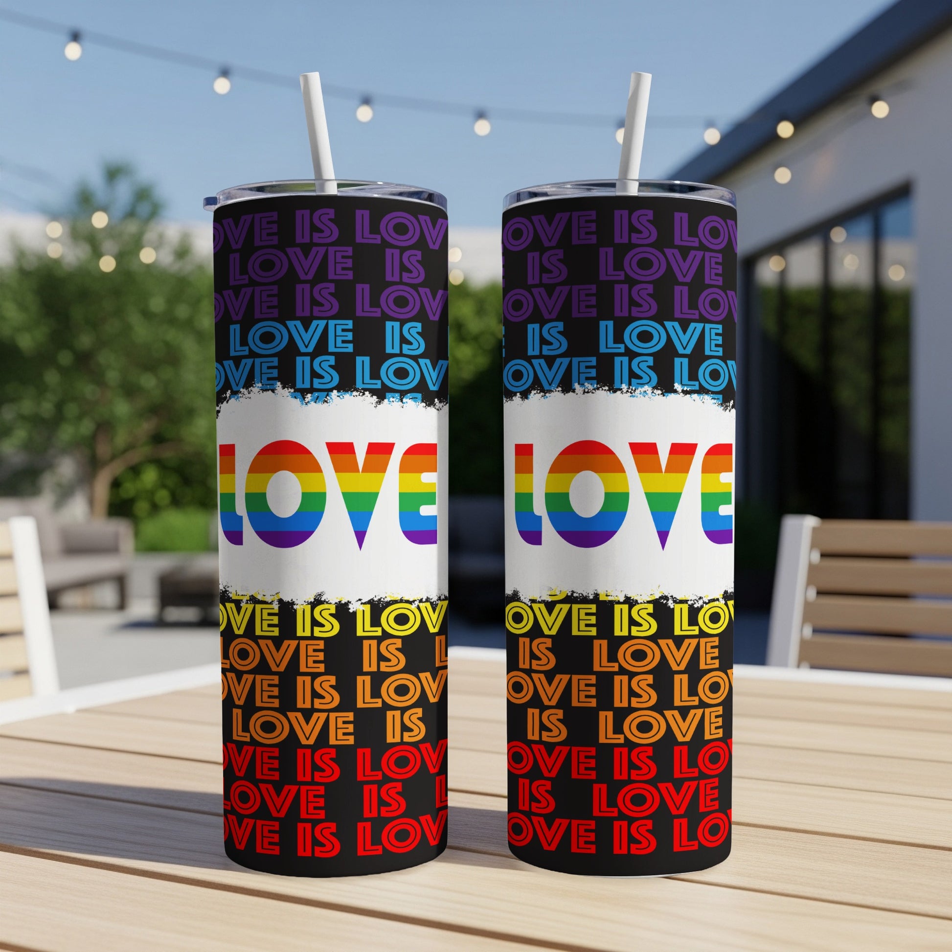 Tumbler with repeating "LOVE IS LOVE" text in rainbow colors.