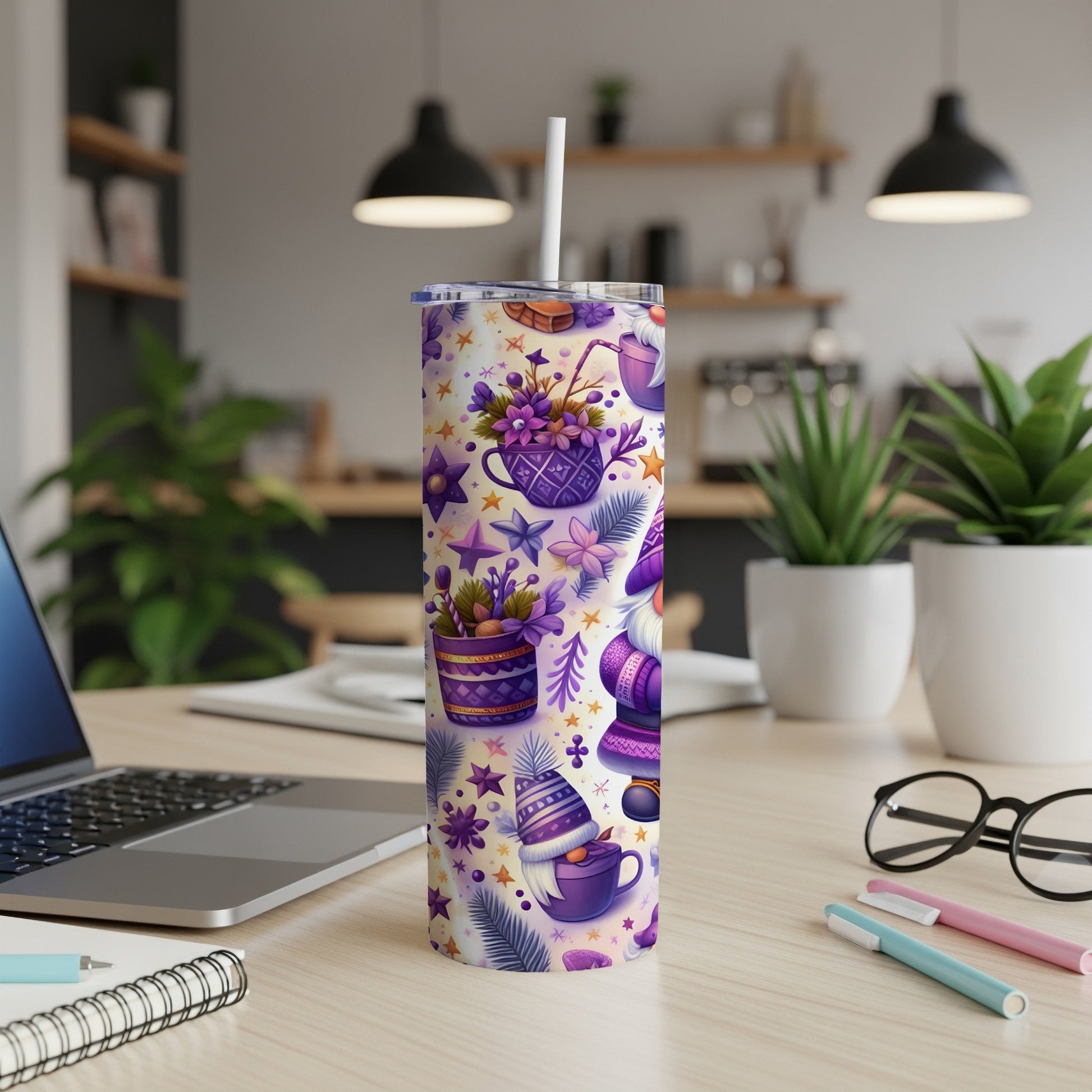 Purple and white patterned tumbler with cups, hats, and stars on a desk.