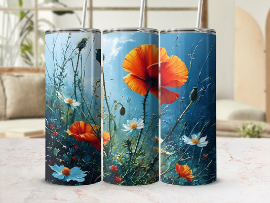 Three tumblers with a vibrant poppy and floral meadow design against a sky backdrop.