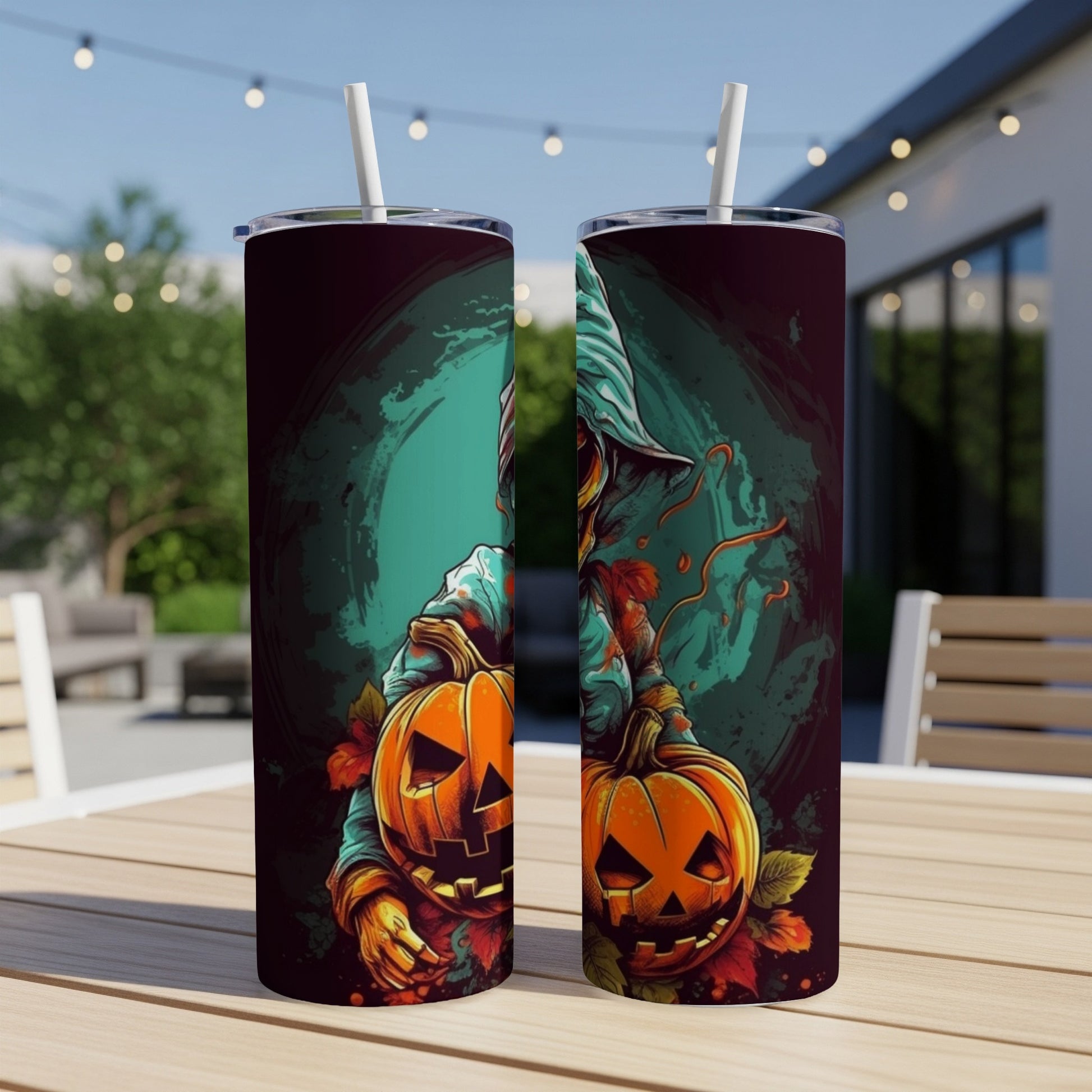 Two tumblers featuring a scarecrow holding jack-o'-lanterns with fall leaves.