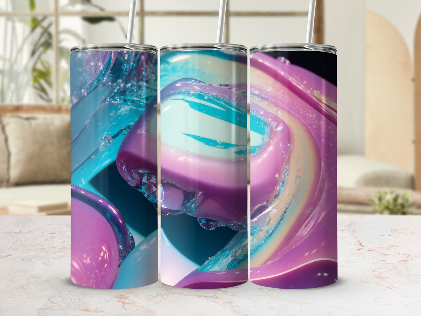 Three tumblers with colorful marbled patterns and straws displayed on a counter.