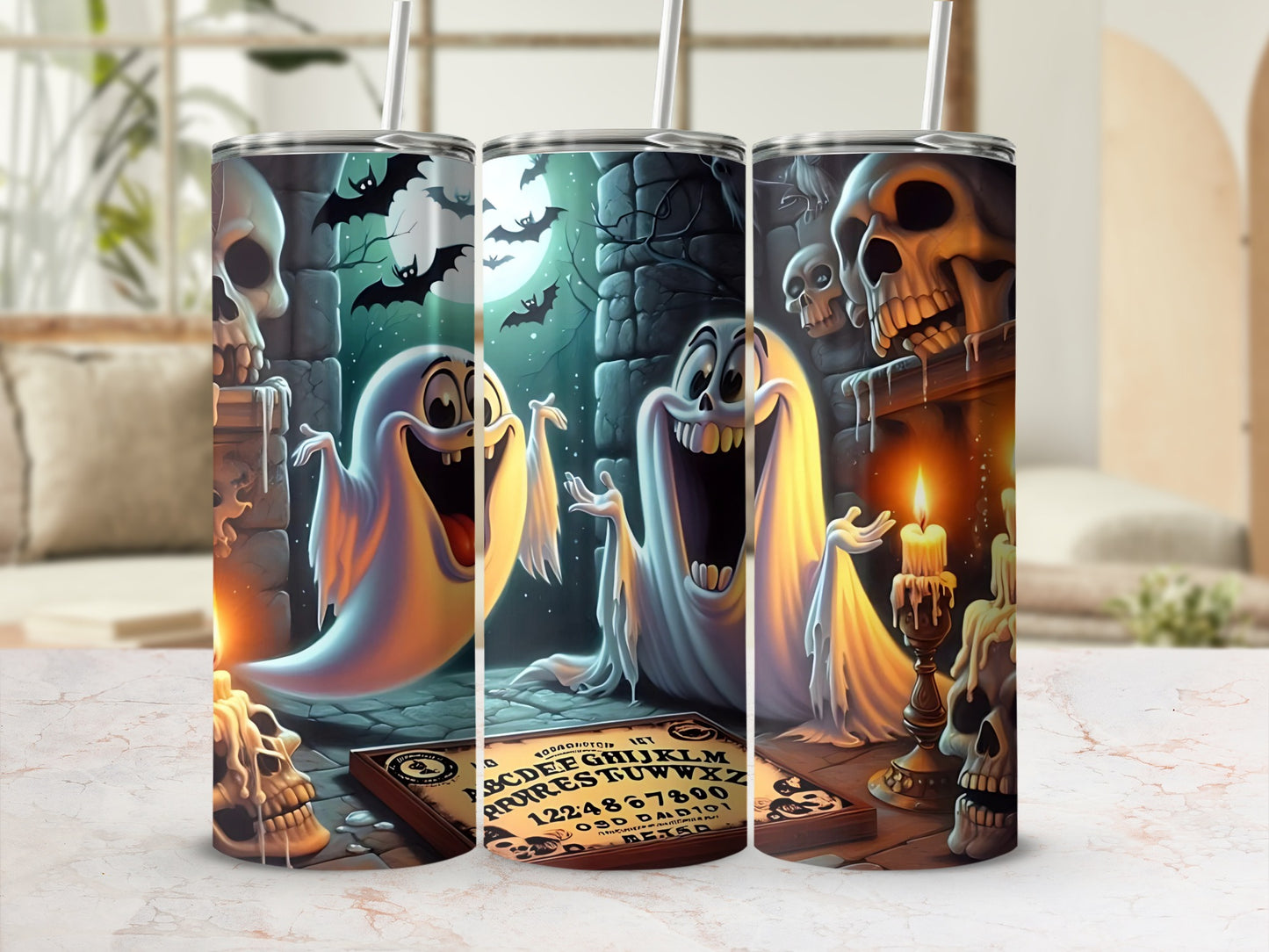 Three tumblers featuring Halloween ghosts, skulls, bats, and a Ouija board design.