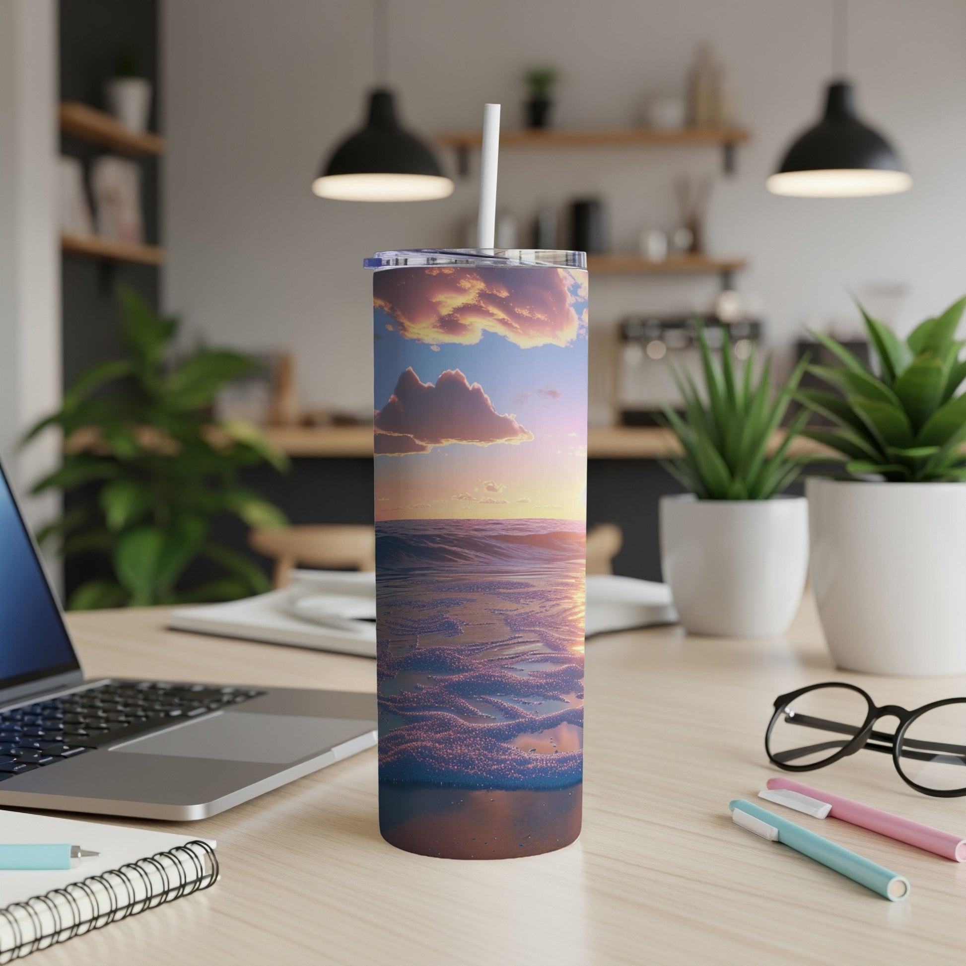Beach sunset scene on a skinny tumbler with a straw.