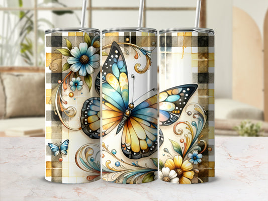 Three tumblers with floral and butterfly designs on a plaid background.
