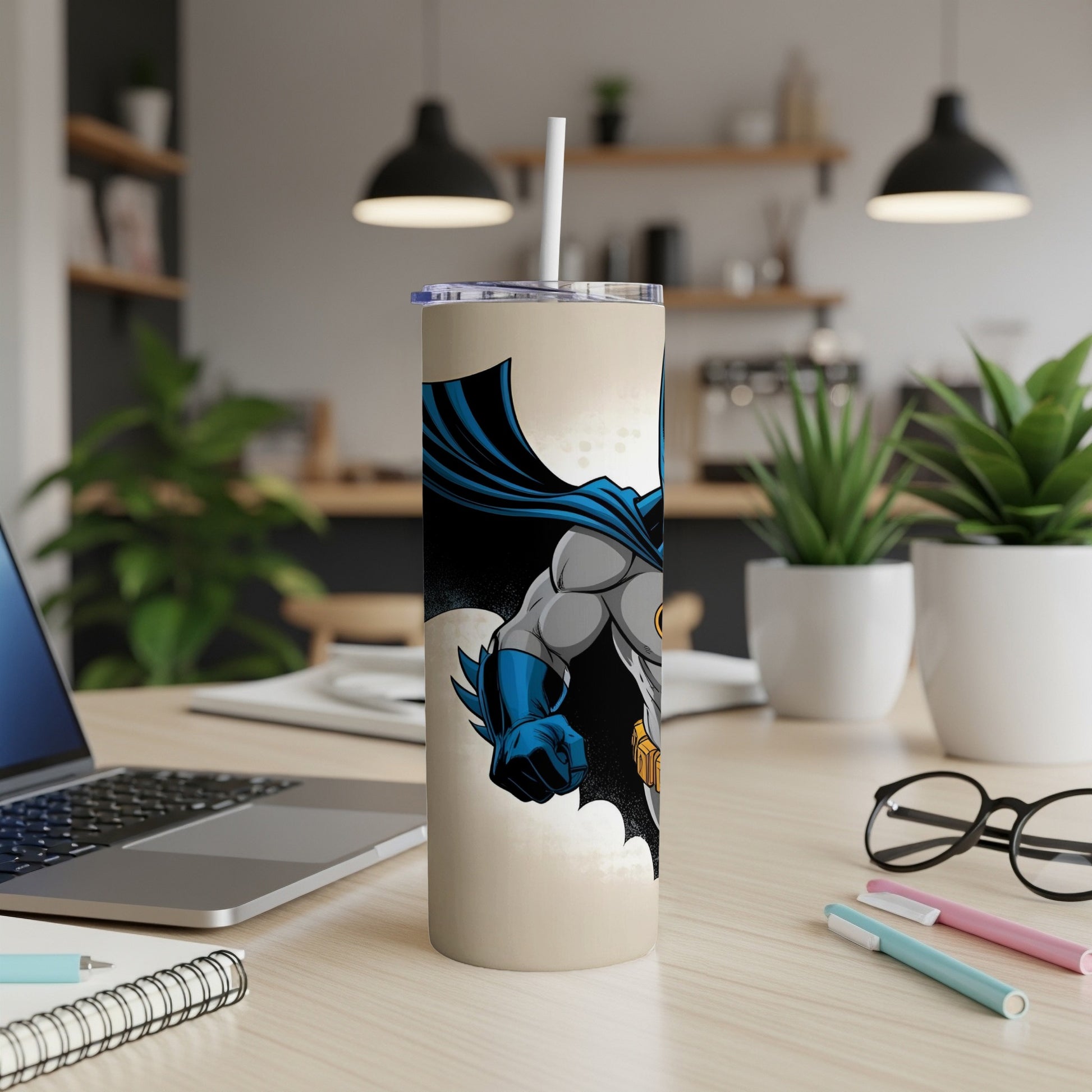 Batman cartoon character on a beige tumbler with straw.