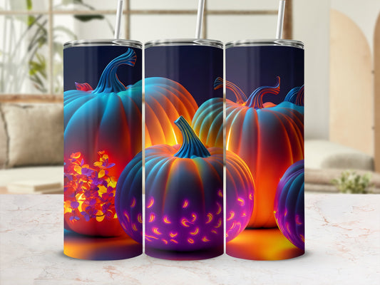 Three tumblers with glowing pumpkins and floral designs.