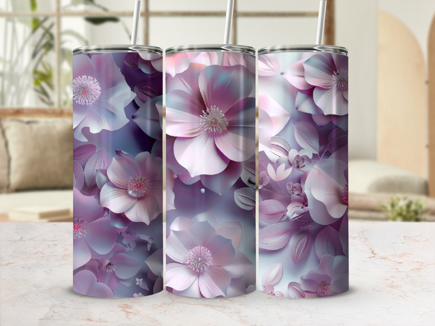 Three tumblers with a large, abstract floral design in shades of pink and purple.