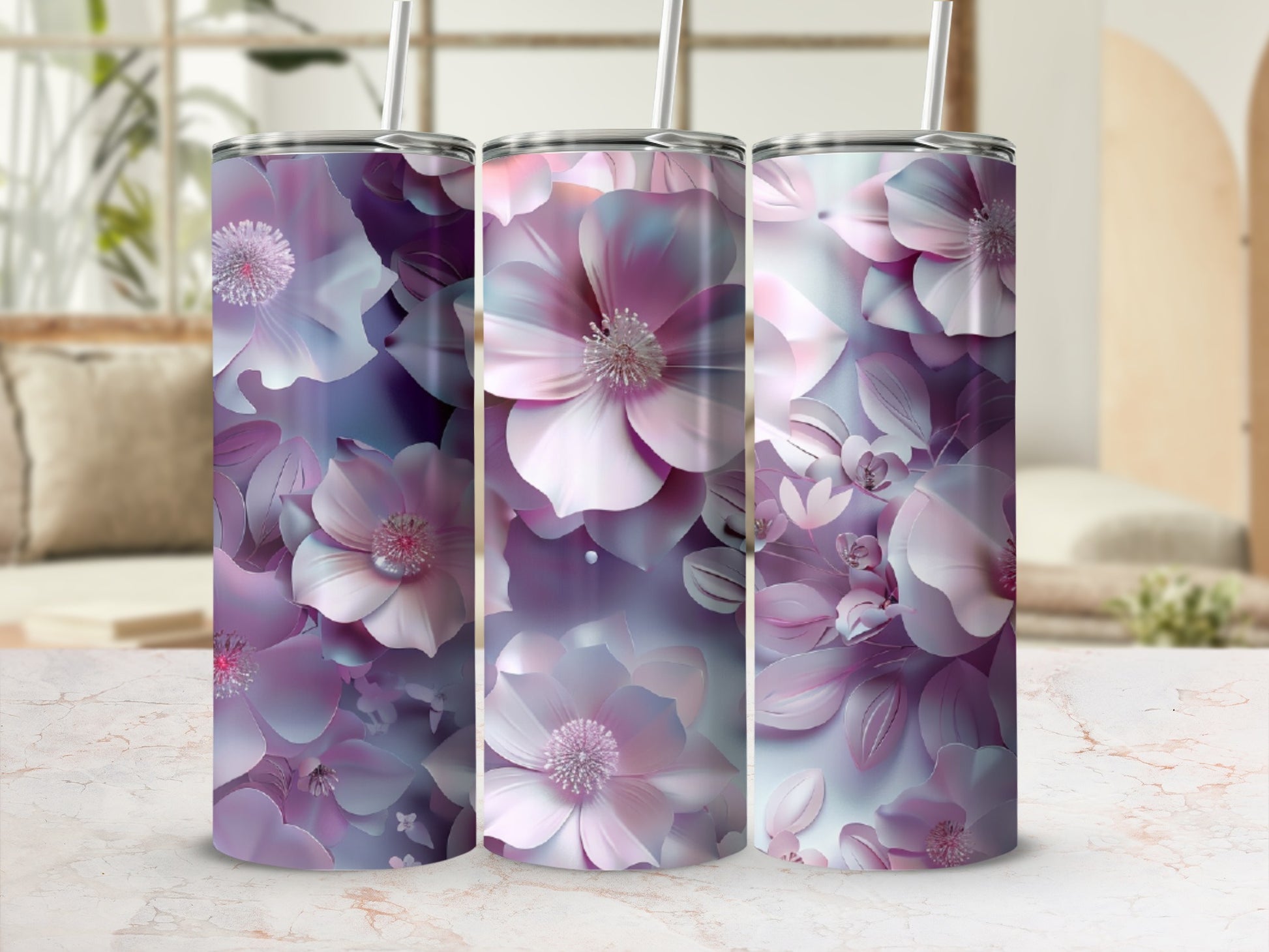 Three tumblers with a large, abstract floral design in shades of pink and purple.