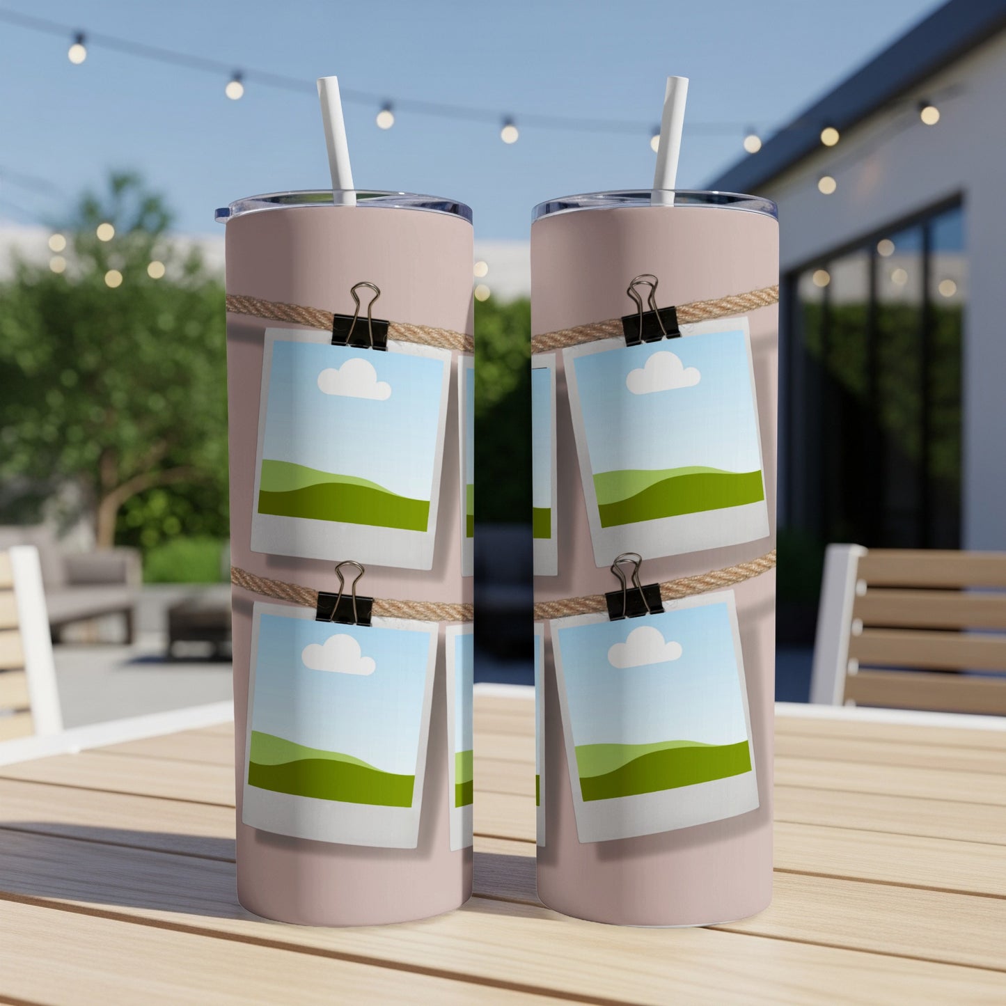 Pink tumblers with a rope and photo design, one straw in each.