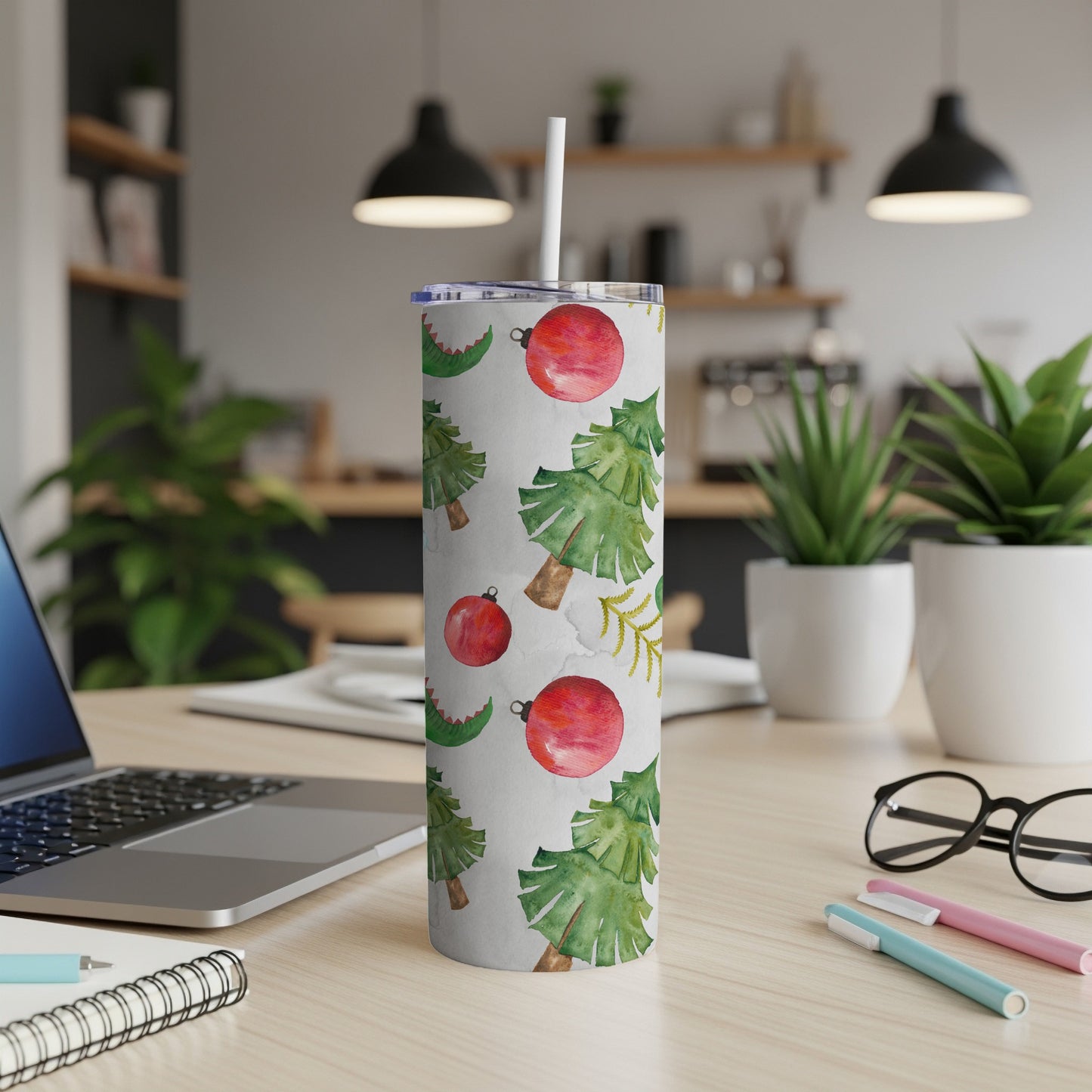 White tumbler with watercolor Christmas trees, ornaments, and festive accents.
