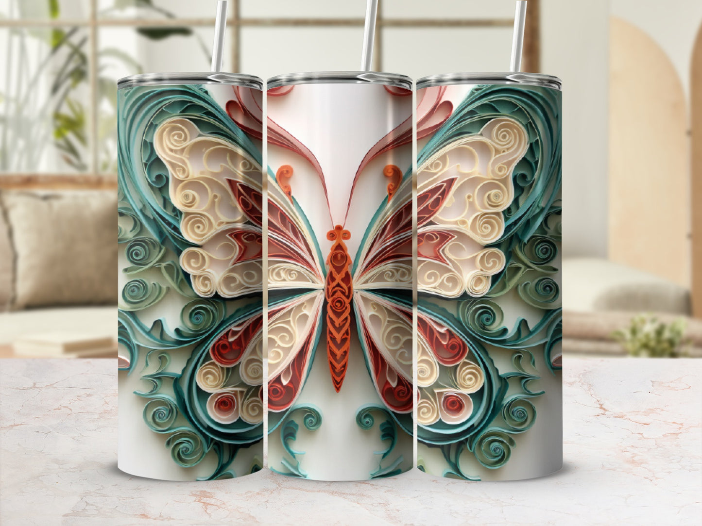 Three tumblers with ornate quilled butterfly designs.