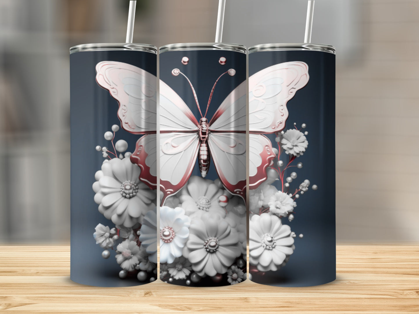 Pink butterfly and white flowers adorn a stainless steel tumbler.
