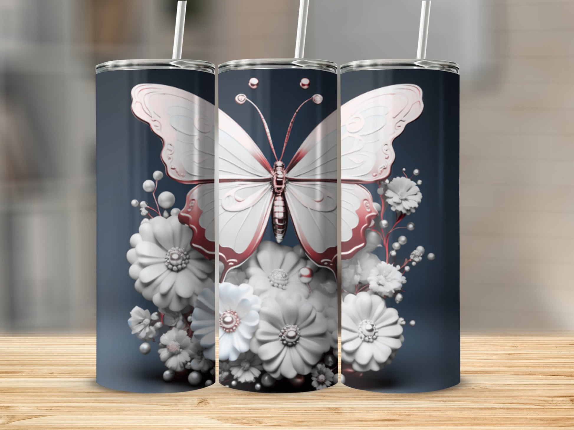 Pink butterfly and white flowers adorn a stainless steel tumbler.