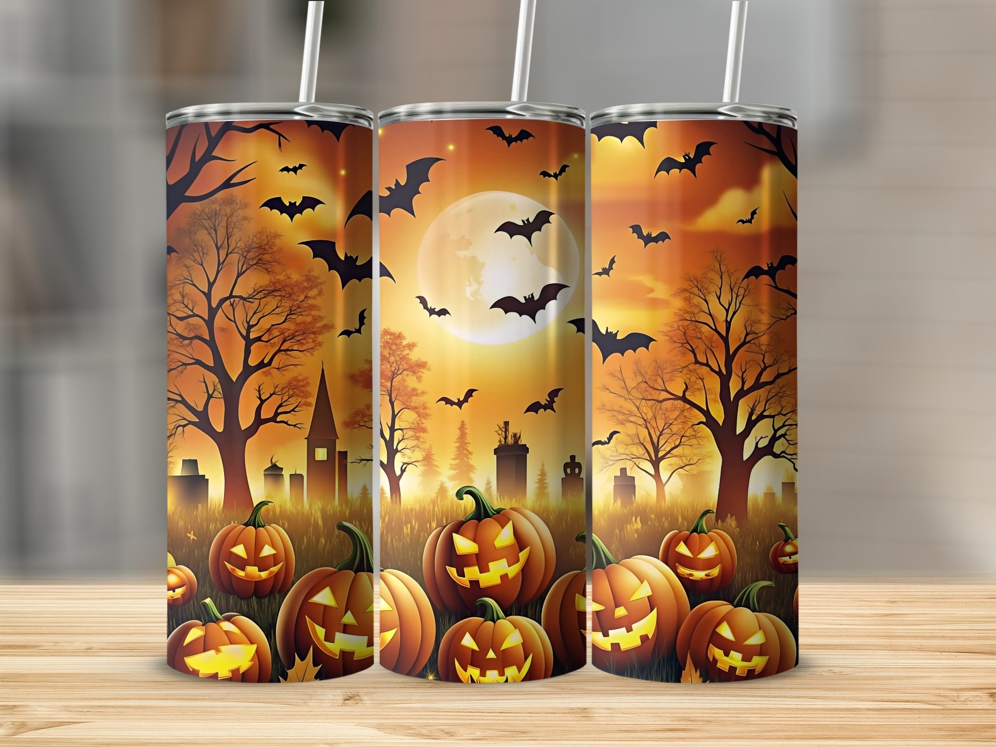 Halloween tumbler with pumpkins, bats, a full moon, and a spooky landscape.
