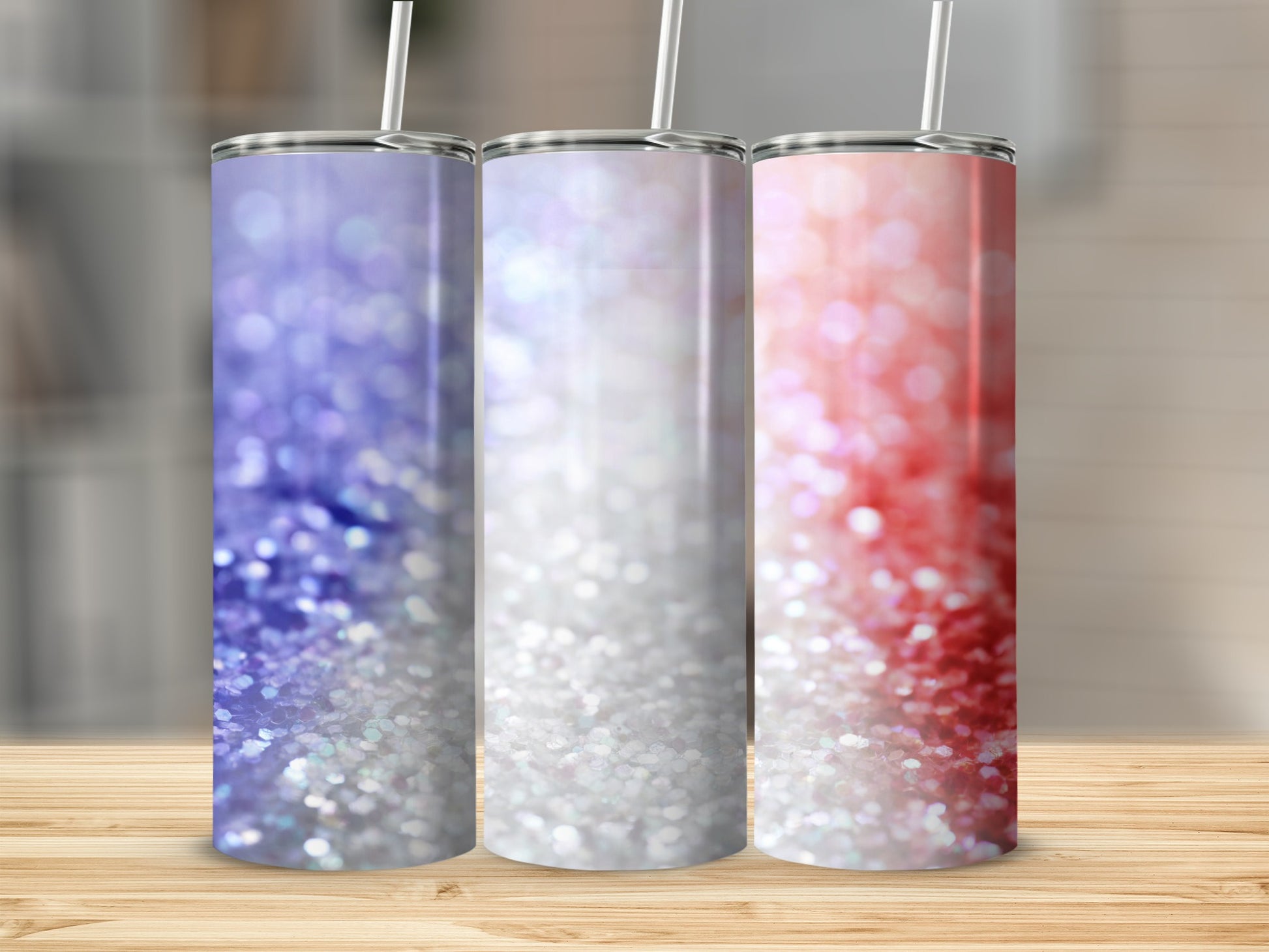 Three glitter tumblers in shades of purple, white, and red.