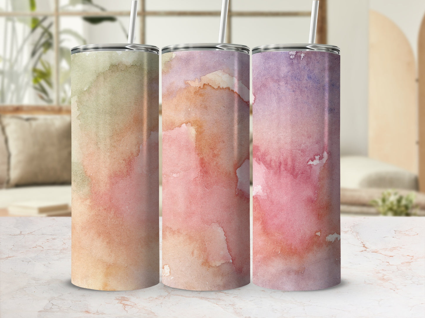 Three tumblers with watercolor washes of green, pink, and purple.