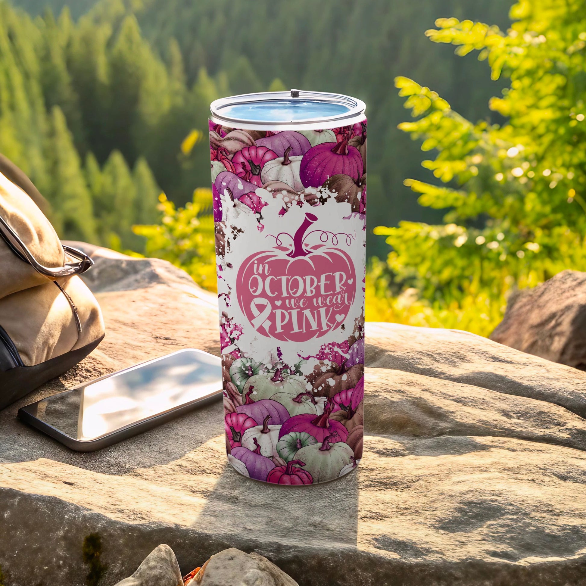 Pink ribbon pumpkin pattern tumbler with text "In October We Wear Pink."