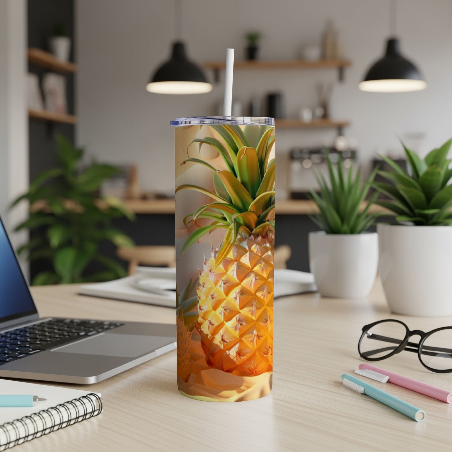 Tumbler with a realistic pineapple design, set on a desk.