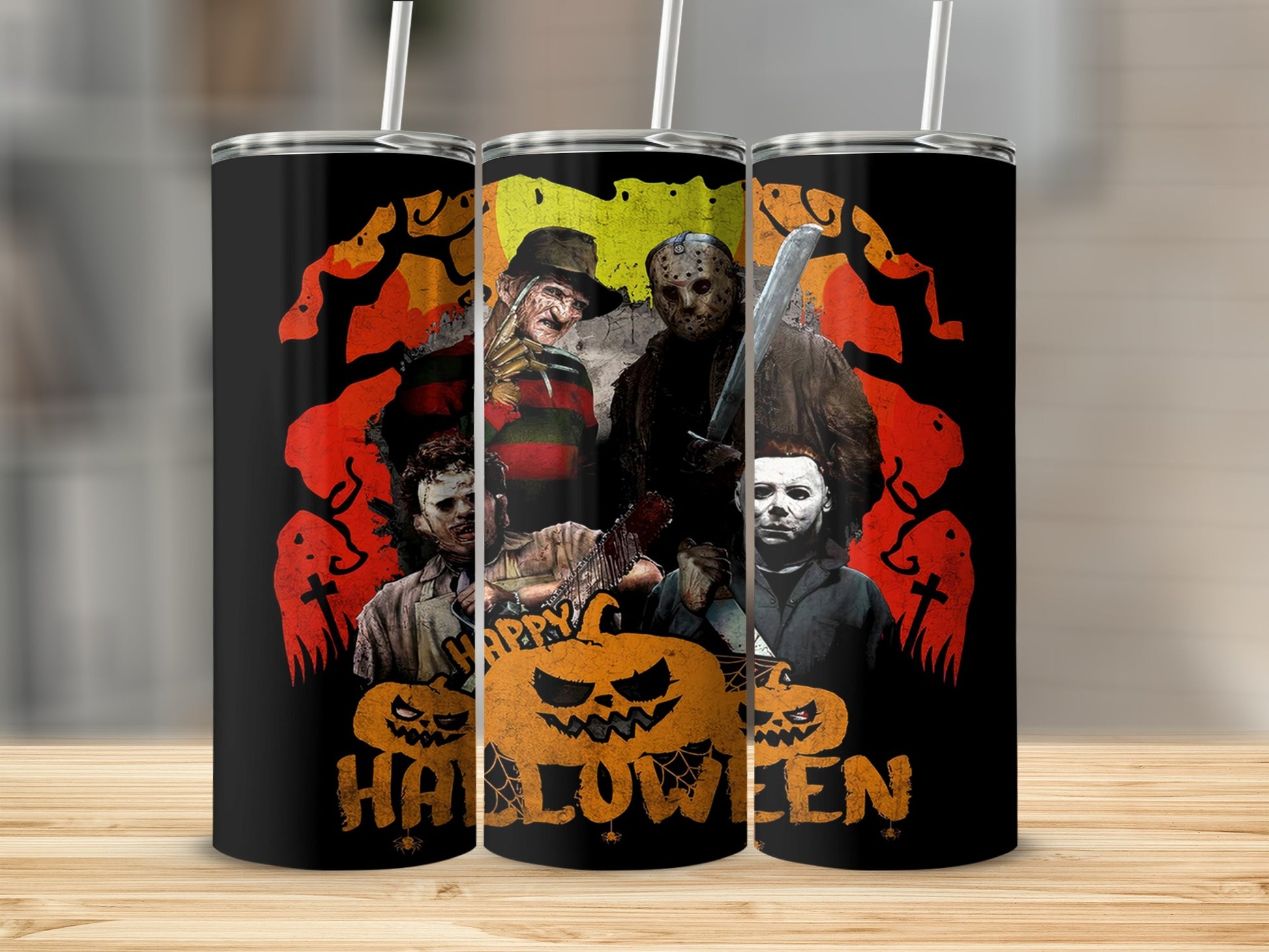 Horror movie villains and pumpkins on a black Halloween tumbler.