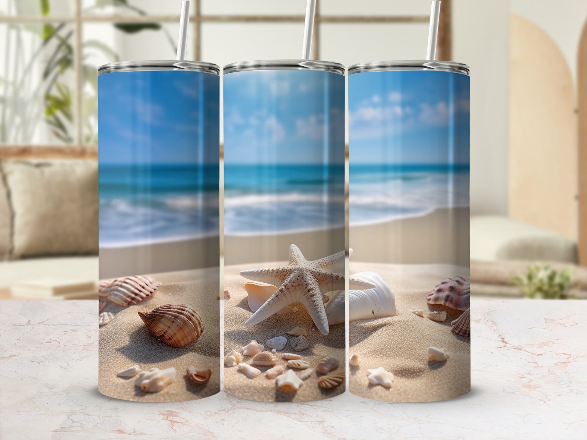 Three tumblers on a sandy beach with seashells and ocean waves.