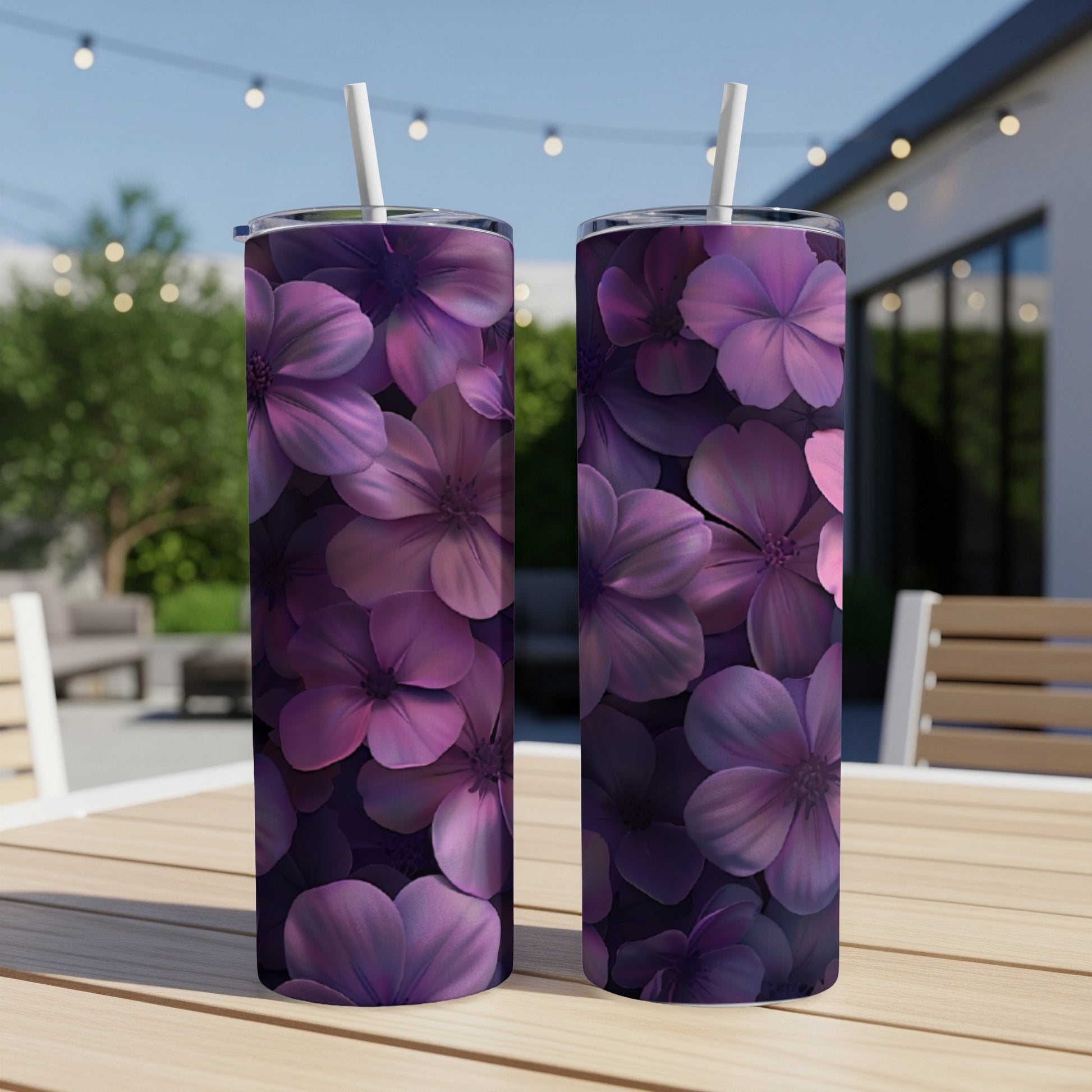 Two tall tumblers with a repeating pattern of dark purple floral illustrations.