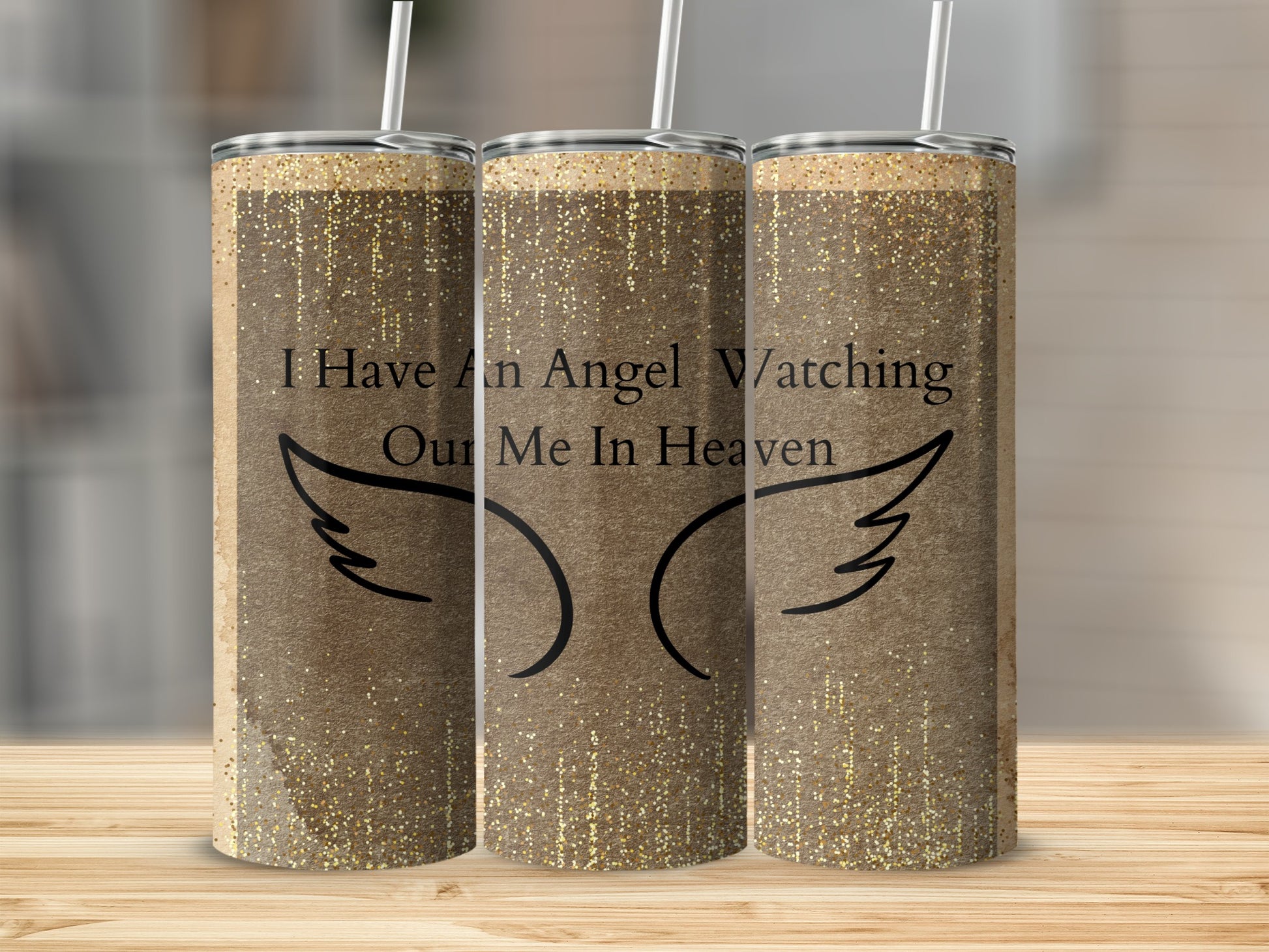 Tumbler with wings and text "I Have An Angel Watching Over Me In Heaven".