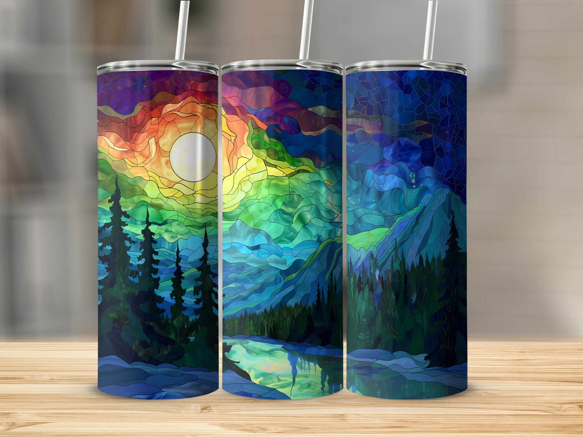 Three stained-glass effect tumblers with mountain, forest, and moonscape designs.