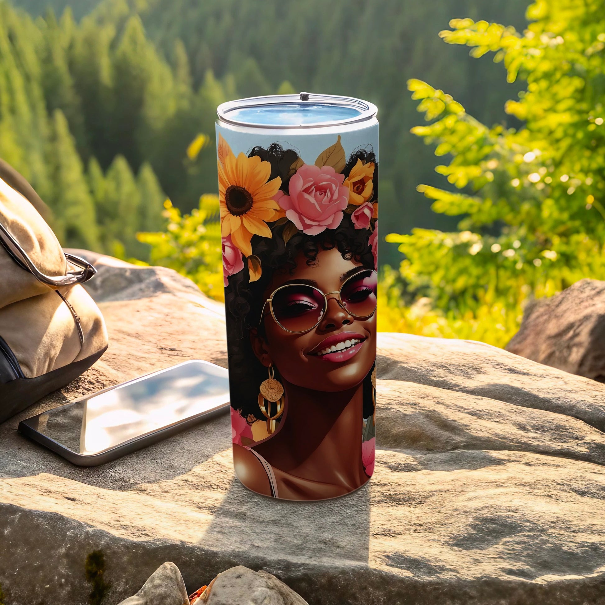 Tumbler with floral design featuring a smiling woman with sunglasses and flowers in her hair.