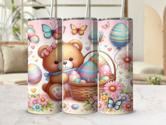 Teddy bear in Easter basket with colorful eggs and butterflies on pink background.