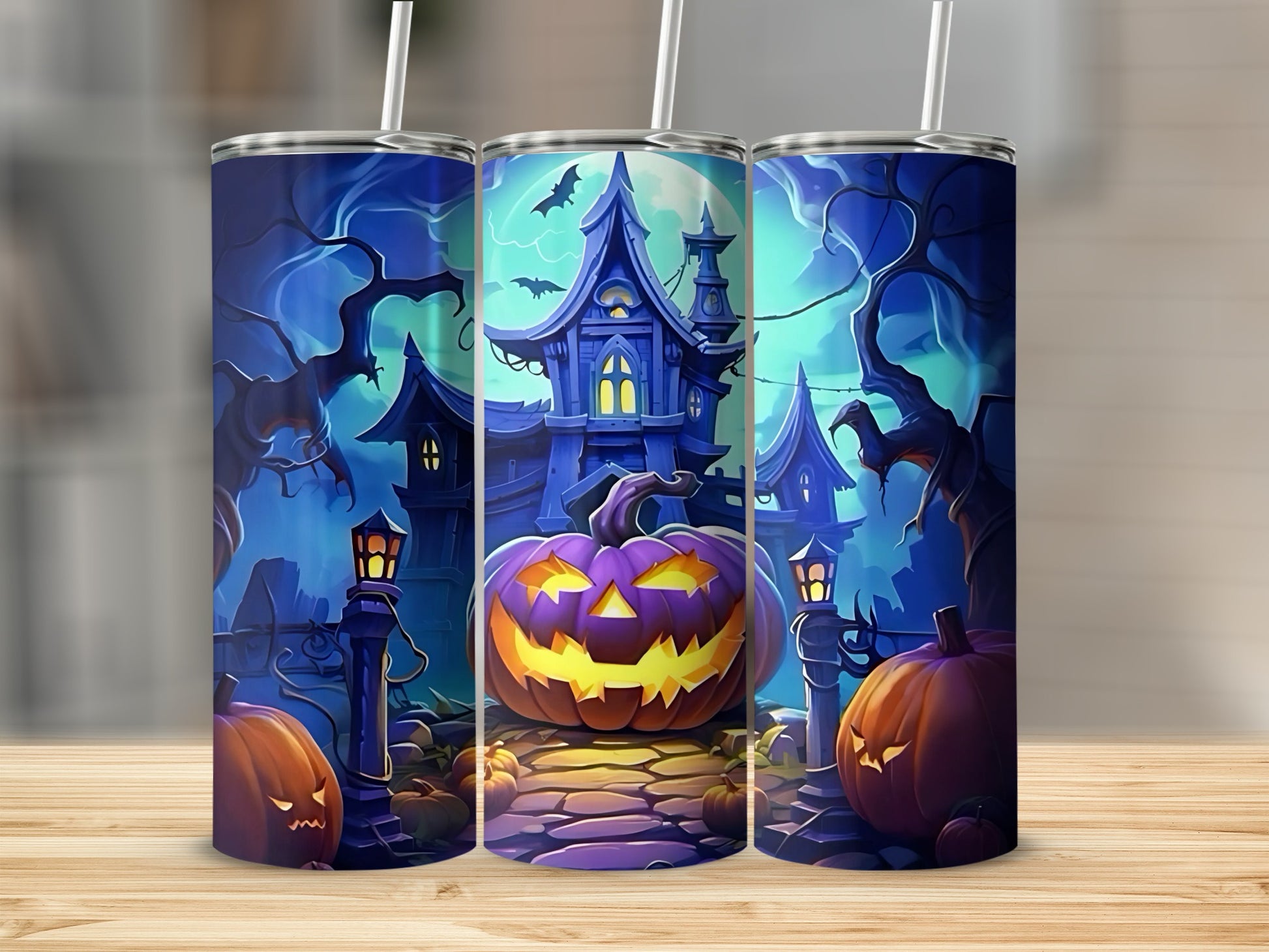 Halloween tumblers featuring a spooky haunted house, pumpkins, and bats.