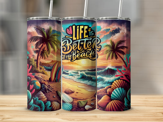 Beach scene with "Life is better at the beach" text on a tumbler.