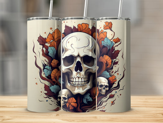Trio of tumblers featuring a large central skull with floral accents and smaller skulls.