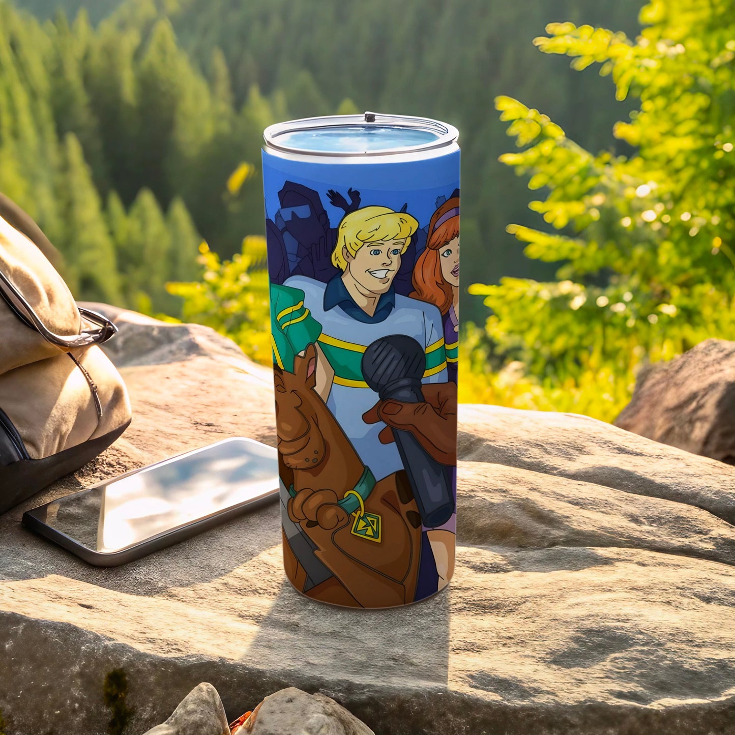 Scooby-Doo characters on a blue tumbler with a microphone.