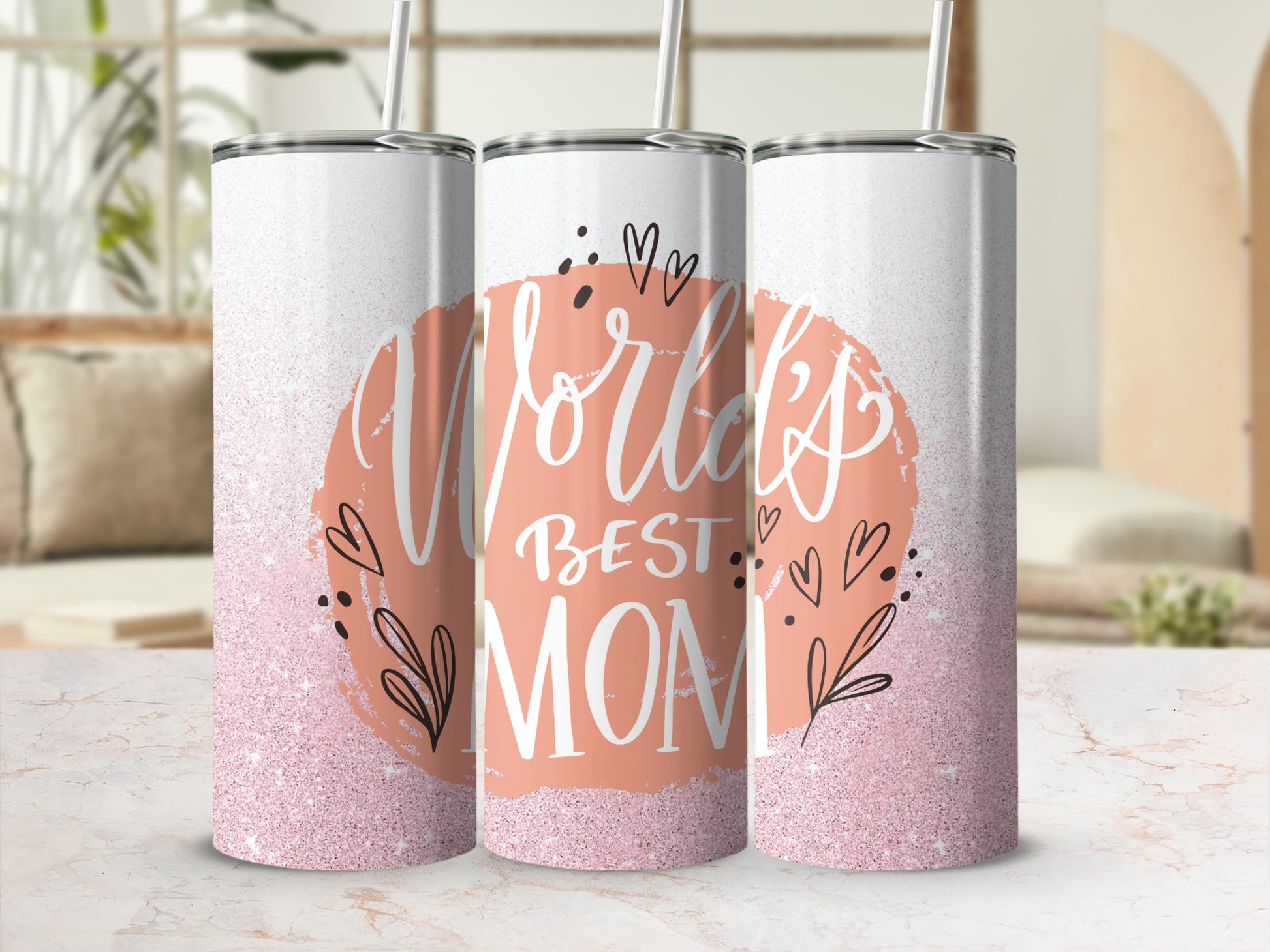 Pink glitter tumbler with "World's Best Mom" text and floral accents.