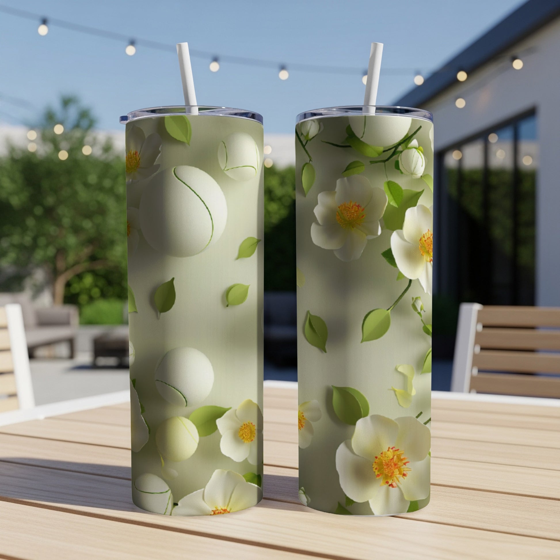 Two tumblers with a light green floral and tennis ball pattern.