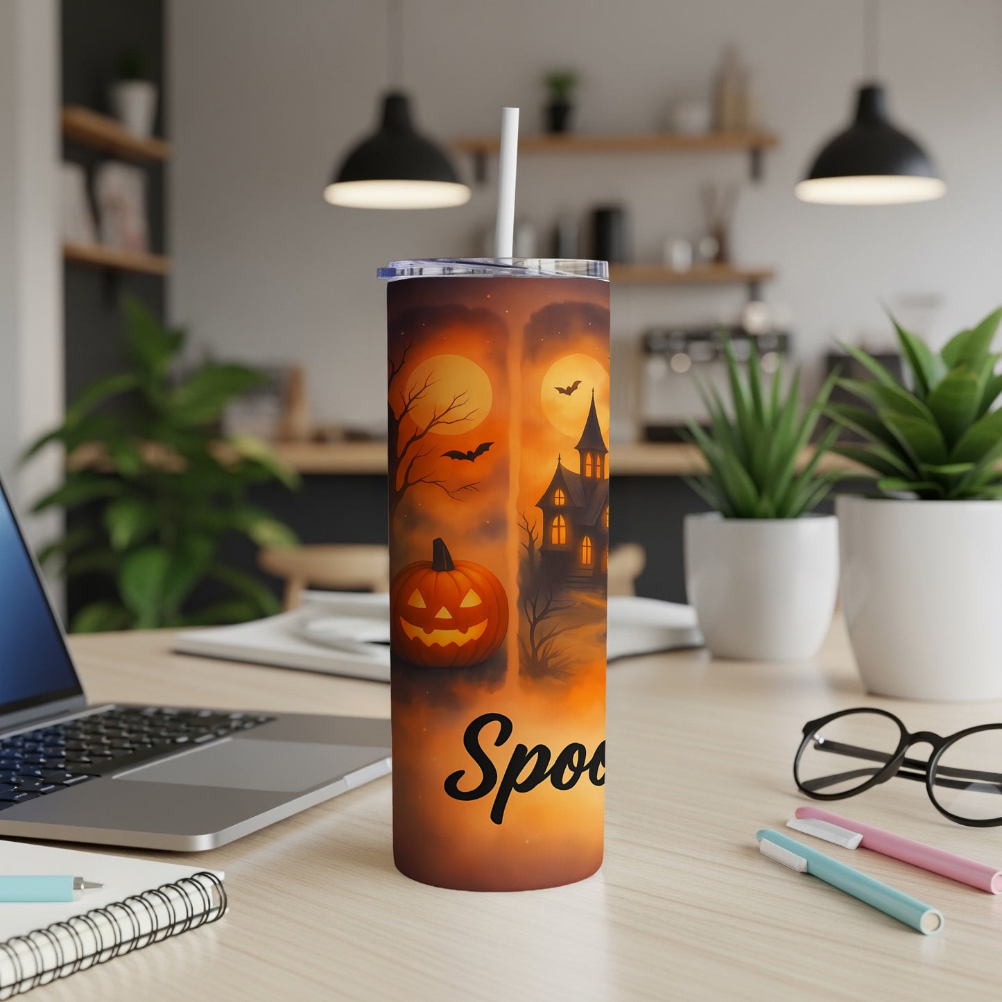 Halloween tumbler with spooky scene, pumpkin, bats, and "Spooky" text.