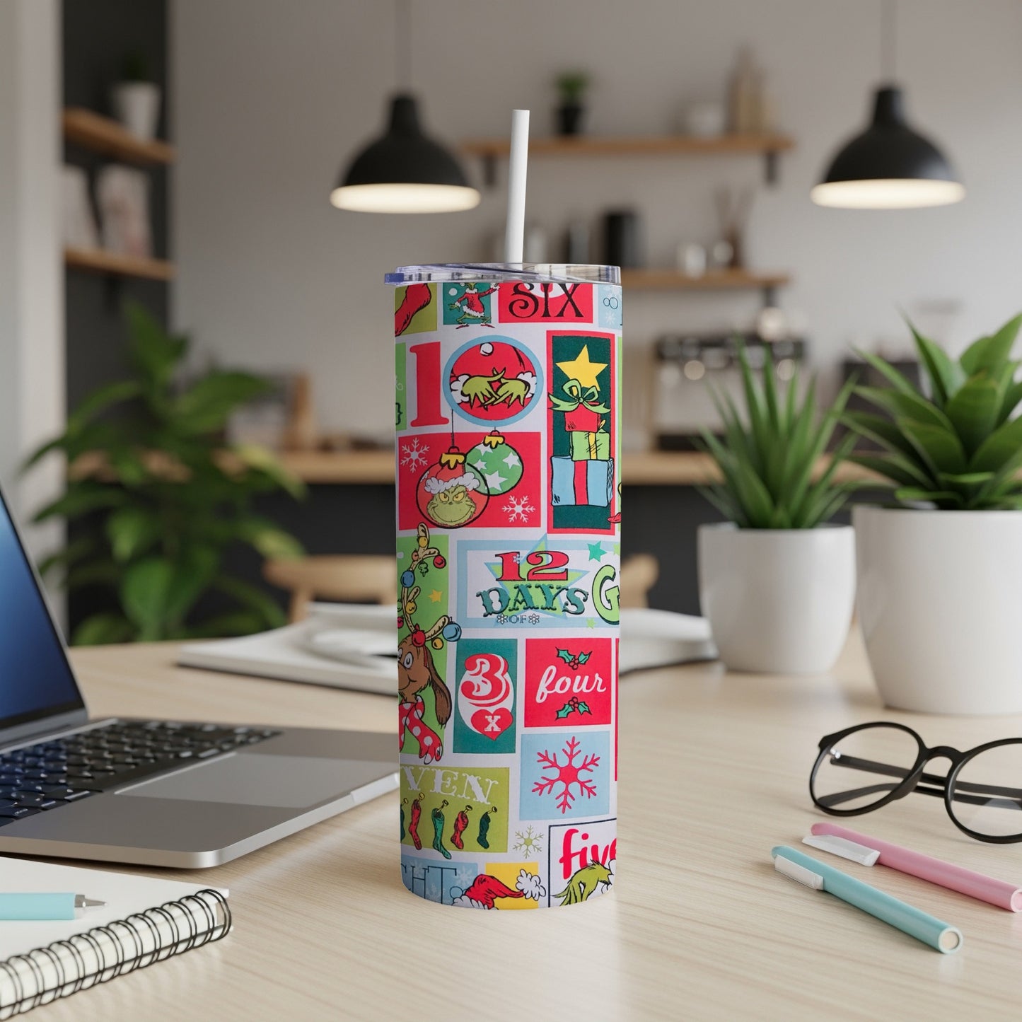 Christmas countdown tumbler with Grinch-themed graphics and numbers.