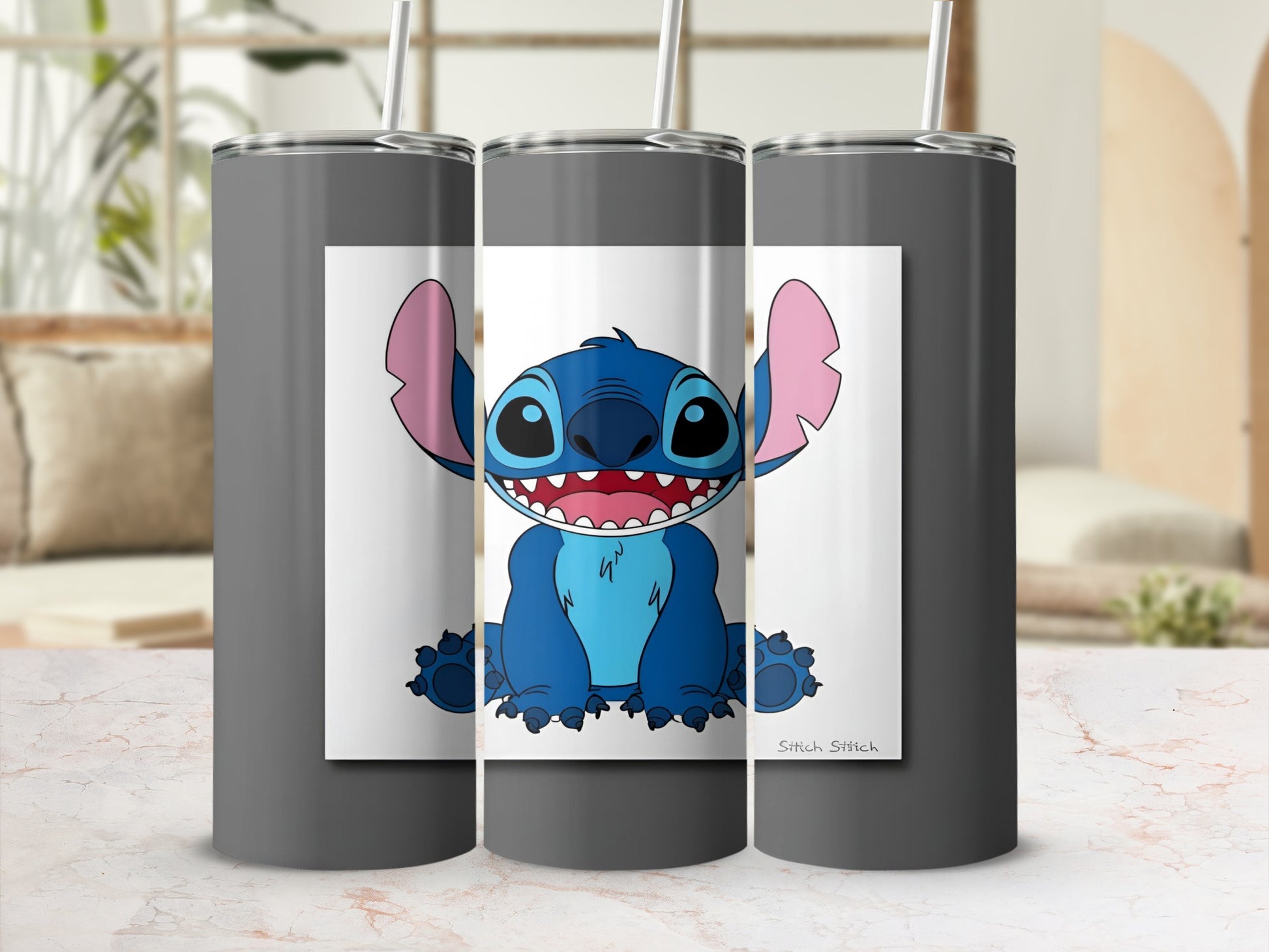 Gray tumbler with cartoon Stitch character and "Stitch Stitch" text.