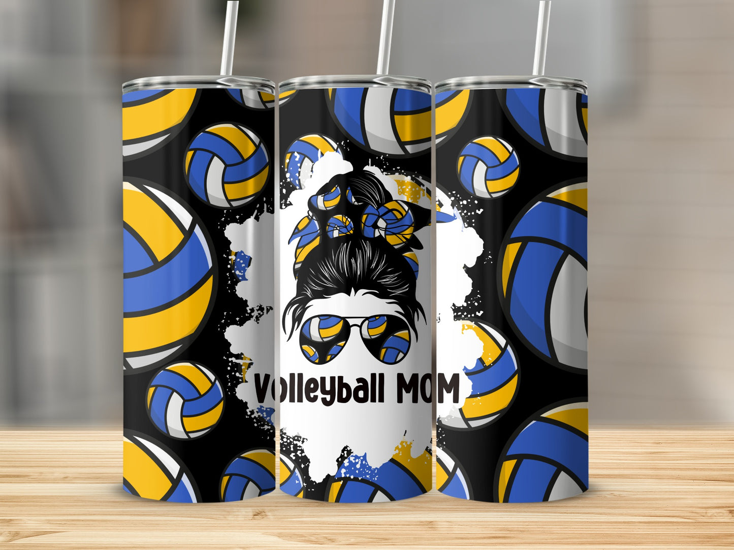 Volleyball Mom tumbler with blue, yellow, and white balls on black background.