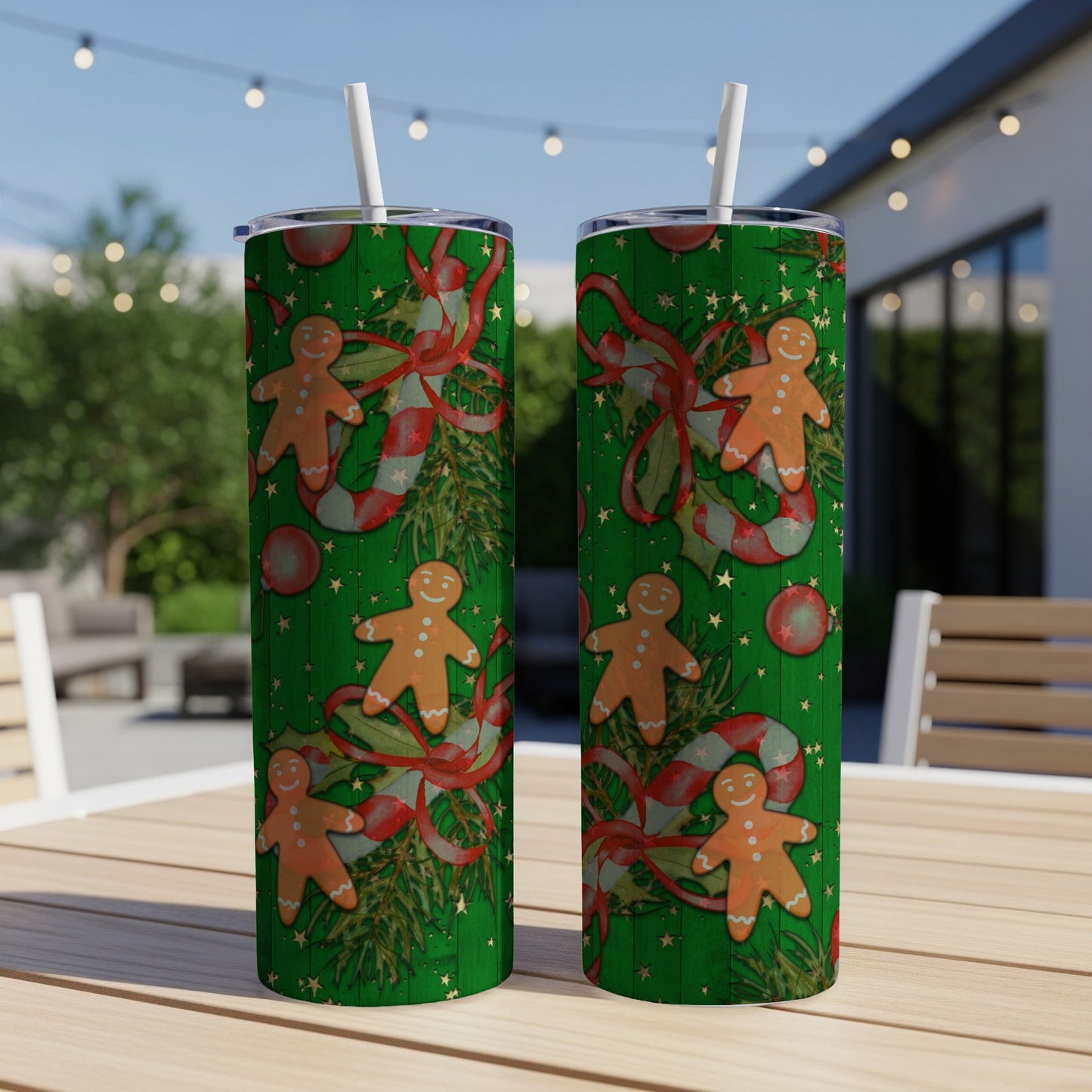 Two green tumblers with gingerbread man and candy cane Christmas pattern.