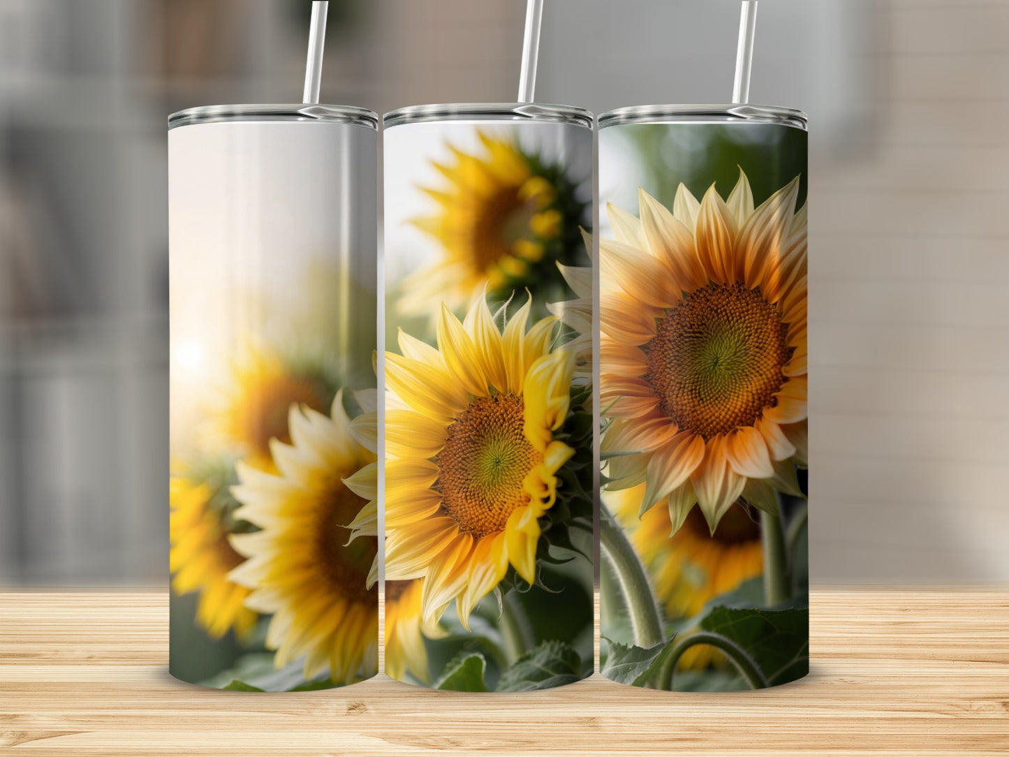 Three tumblers with sunflower designs, displayed on a wooden surface.