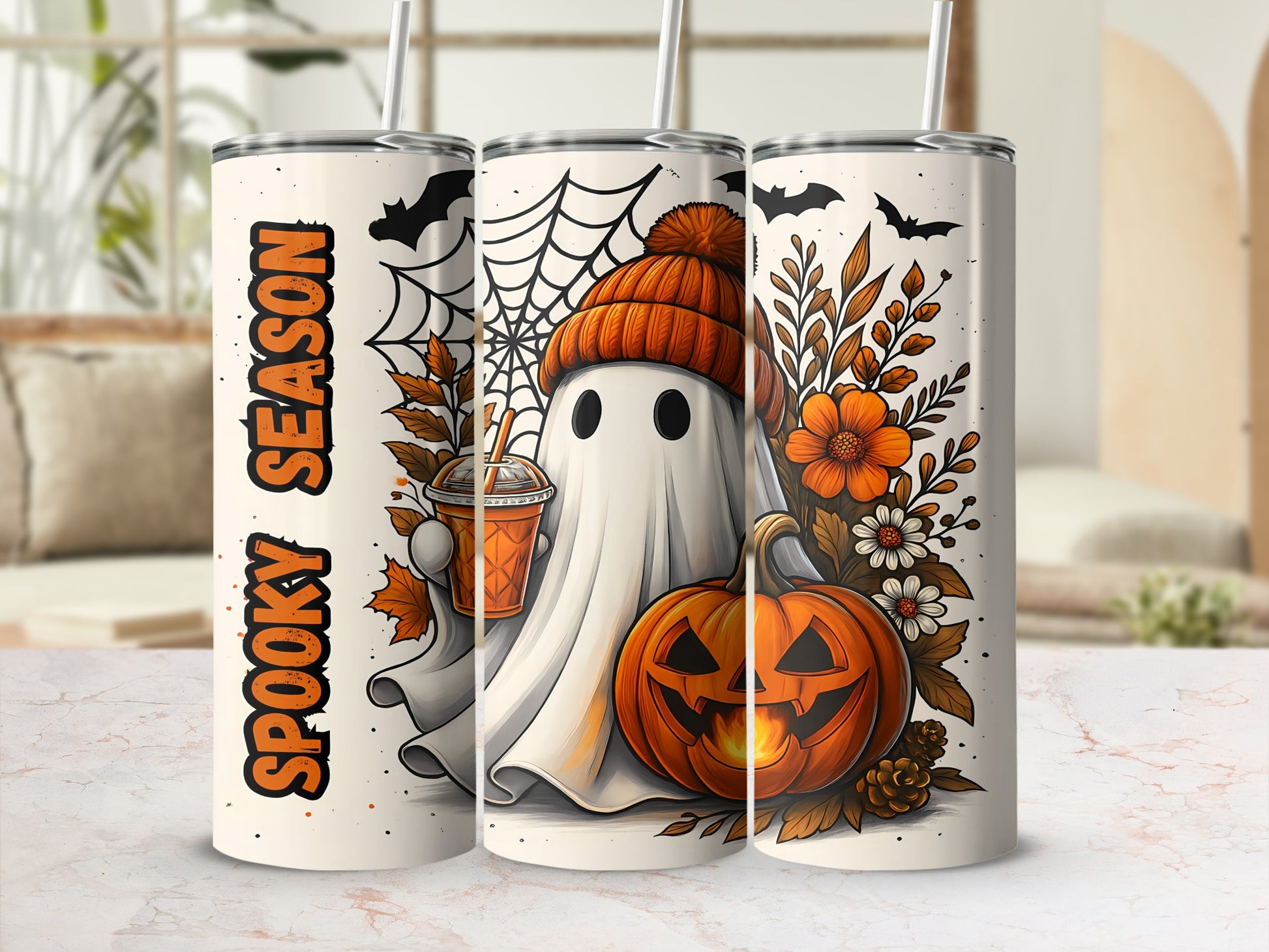 Three tumblers with Halloween ghost, pumpkin, bats, and autumn leaves graphics.