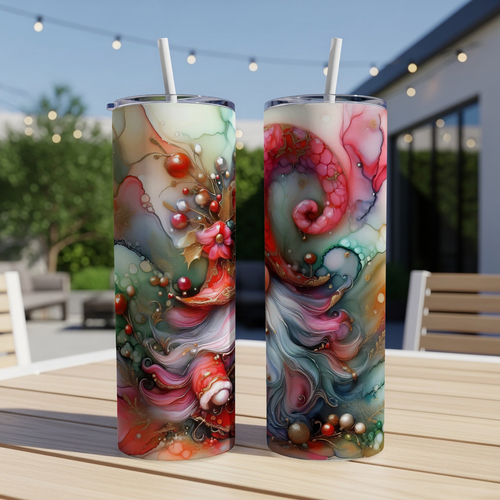 Two tall tumblers with swirling red, green, and gold abstract designs.