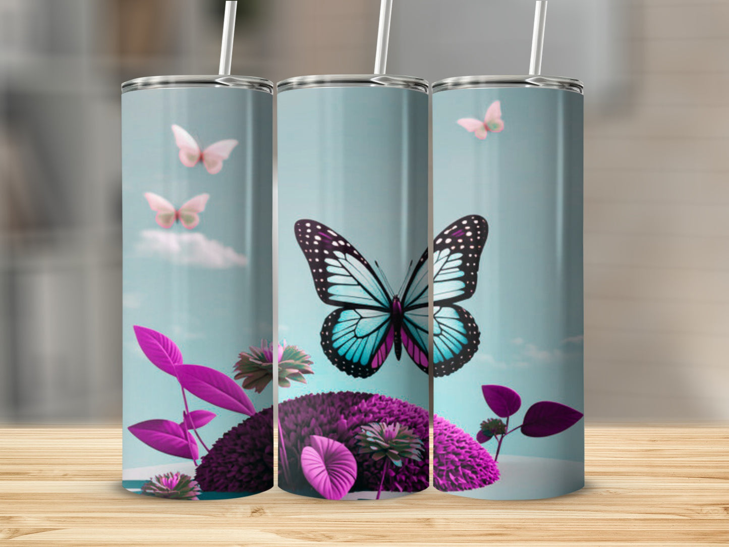 Three tumblers with butterflies and purple flowers on a wooden surface.