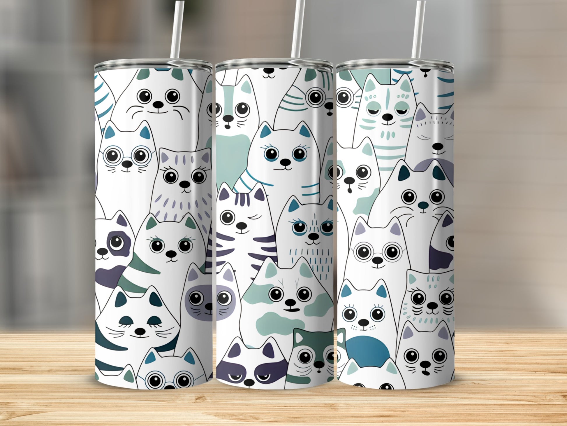 Pattern of stylized cats in white, blue, and green on a tumbler.