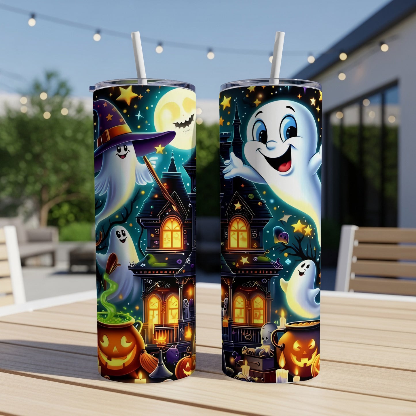 Two Halloween tumblers with ghosts, haunted houses, and pumpkins.