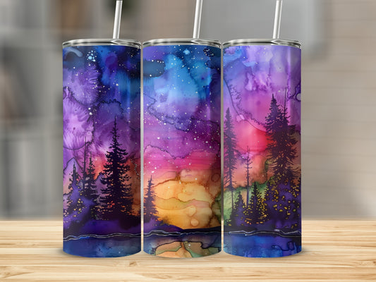 Three tumblers with a colorful galaxy and tree silhouette design.