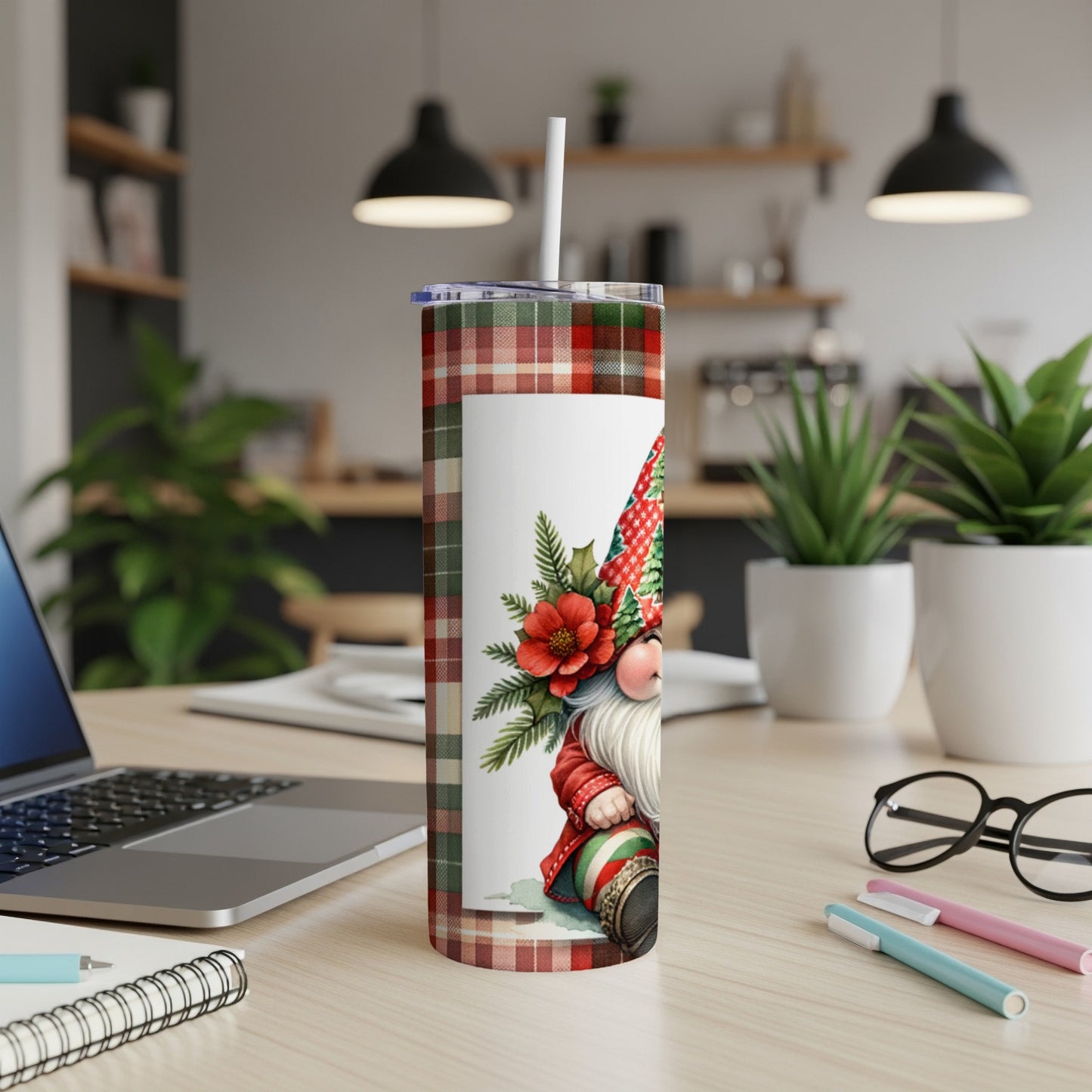Tartan gnome with poinsettias on a white rectangle, on a desktop.